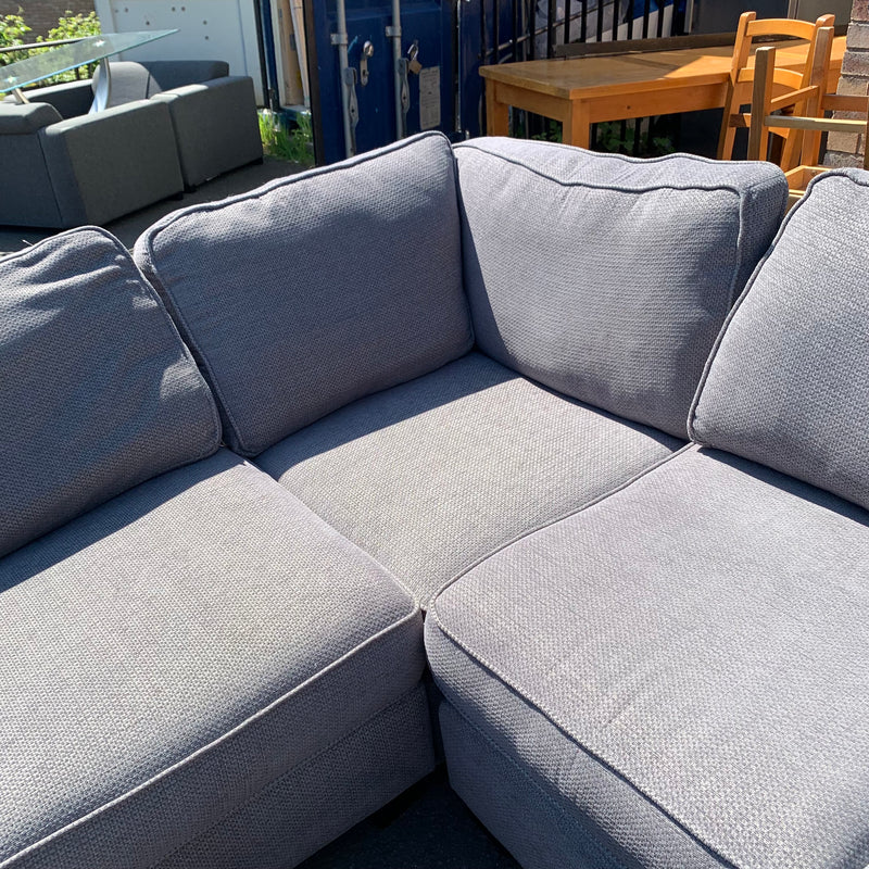 Corner sofa and footstool